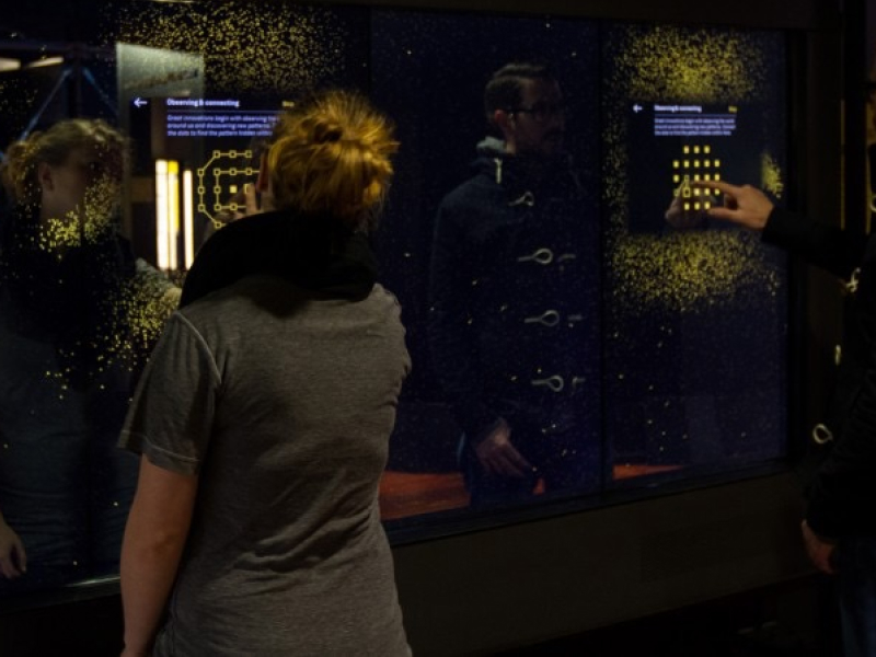 Person using the Launchpad exhibit at the Museum of History and Industry